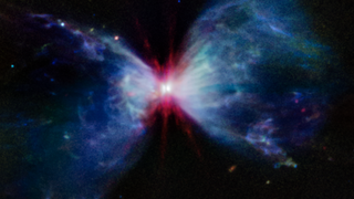 Two glowing blue arcs joined by a bright red smeared sphere.